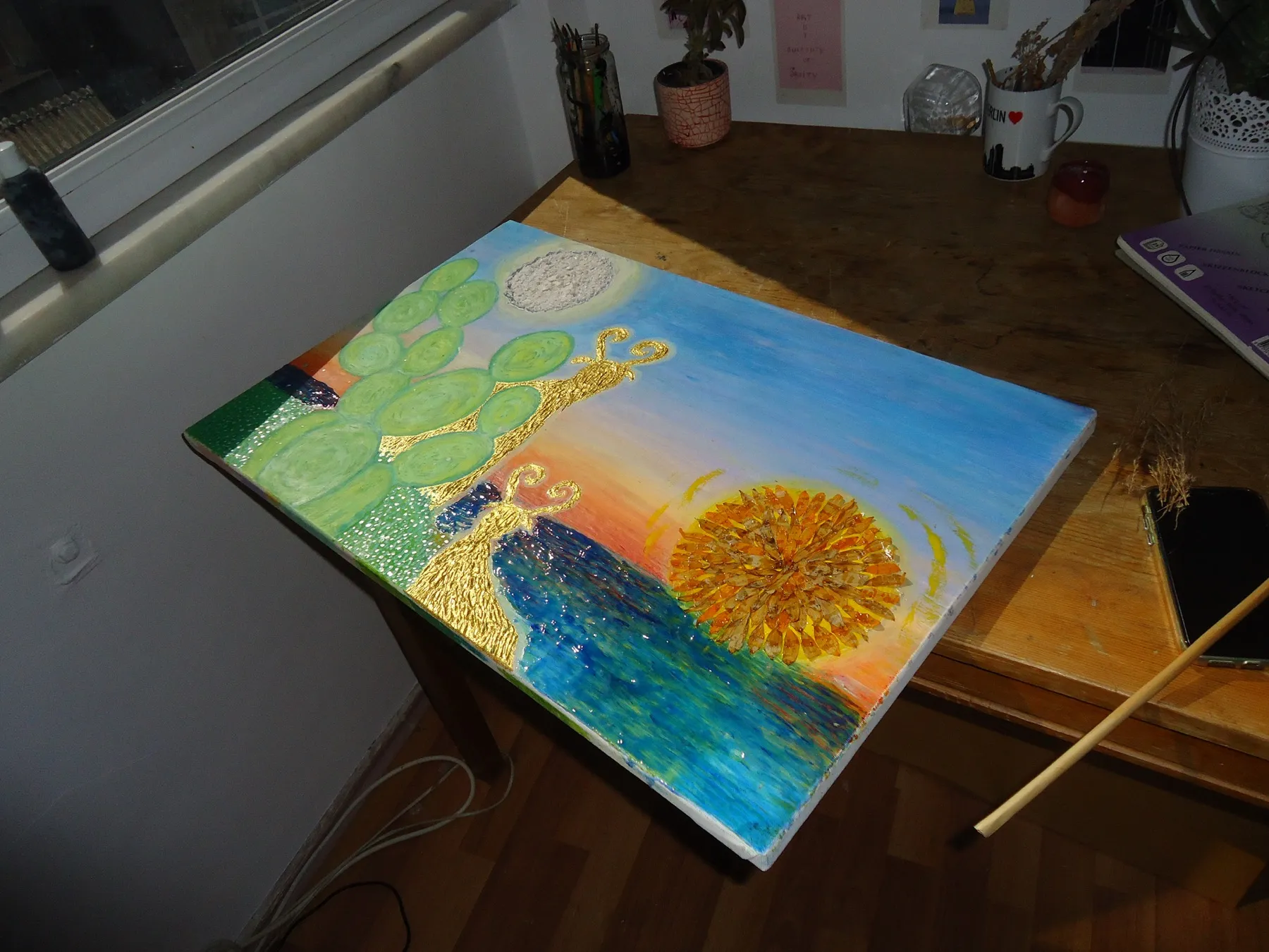 Painting of a figure and a sun on a table