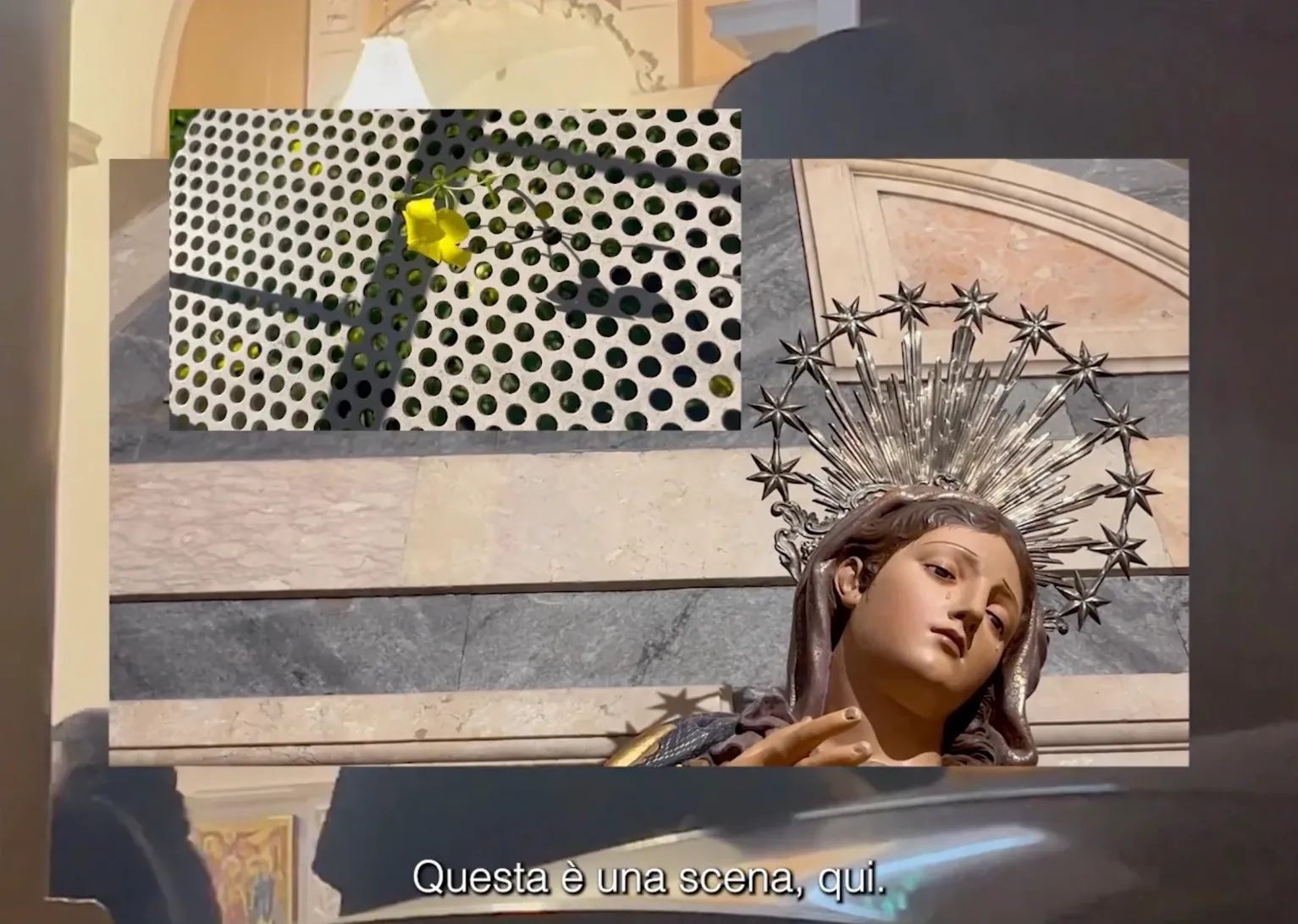 Statue of the Virgin Mary with a halo of stars, collaged with a yellow flower on a perforated surface